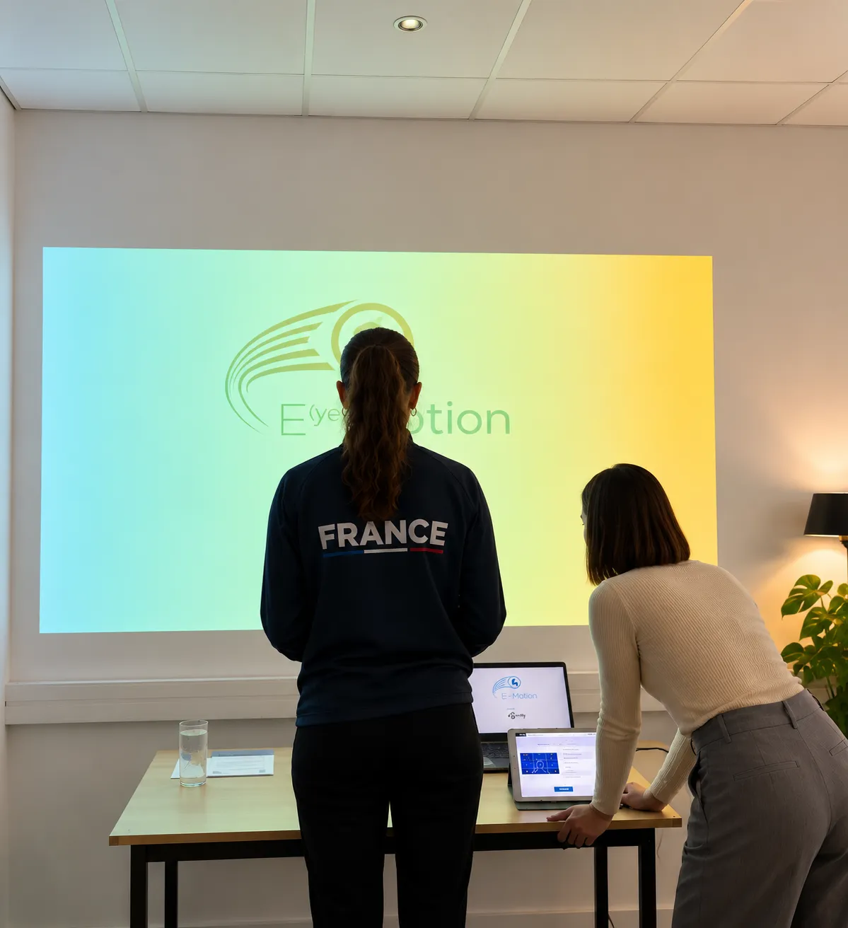 Restitution d’un bilan visuel du sportif devant une projection E-Motion.
